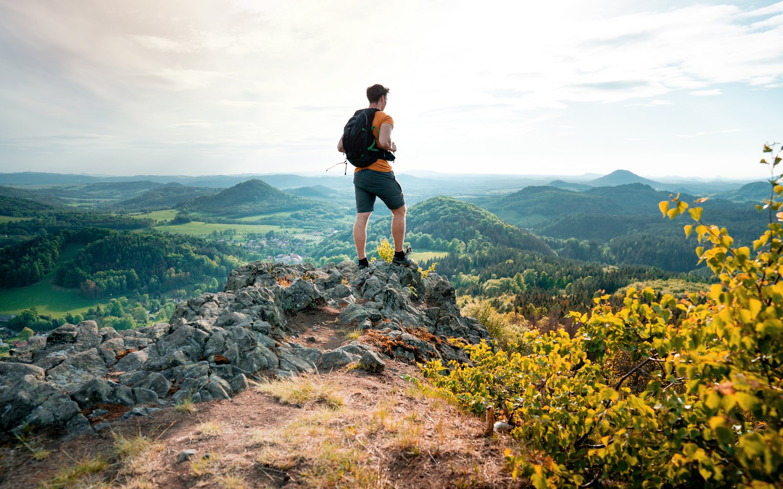 Hiker with a small pack on a ridge